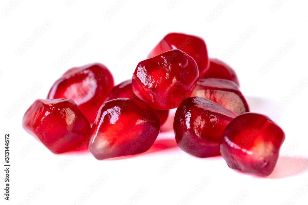 Fresh pomegranate seeds isolated on white background. Close up. Fresh pomegranate seeds isolated on white background. Close up.