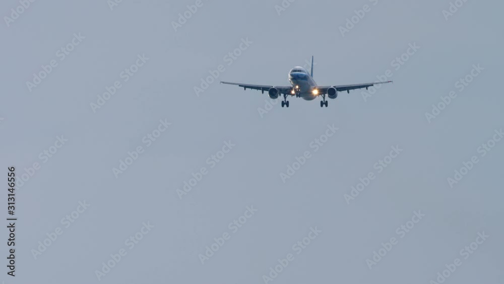 Airplane approaching over ocean Airplane approaching over ocean