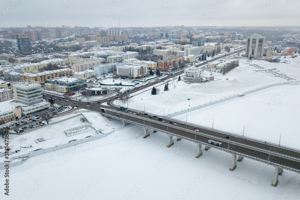 view of the pioneer embankment of the Cheboksary Bay and the bridge over the Bay in Cheboksary in the winter
