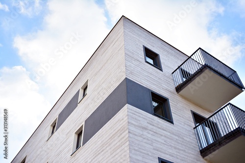 Modern apartment buildings on a sunny day with a blue sky. Facade of a modern apartment building.