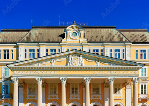 Decor at Hotel building in Old city of Rogaska Slatina in Slovenia in South Styria. Travel in Europe Slovenian luxury spa resort. Summer view. Town destination. Yellow decoration of architecture photo