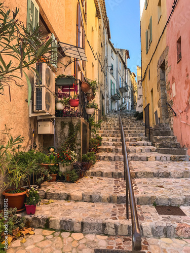 Stone steps with plants in pots in the ild town in France  province