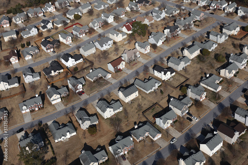 Aerial view of pleasant suburban  homes  rooftops and streets near Atlanta Georgia.  