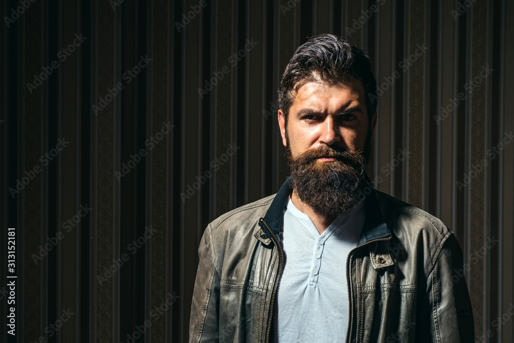 Fototapeta premium Man on vintage interior. Portrait of stylish man beard. Sexy male, macho, long beard.