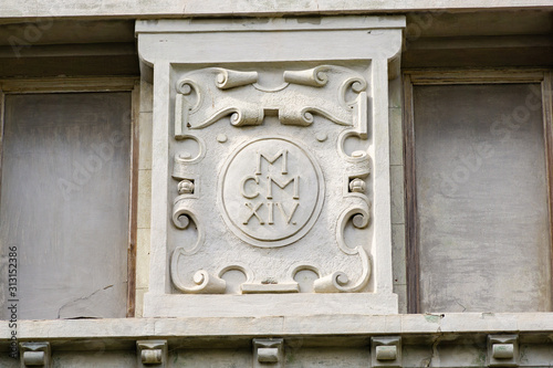 Facade architectural details (MCMXIV) of ancient cottage dacha 'Villa of Solomon Krym' or Villa 'Victoria' (Otrada) on Aivazovsky Avenue was built in 1914. Feodosia, Crimea, Russia - September, 2019 photo