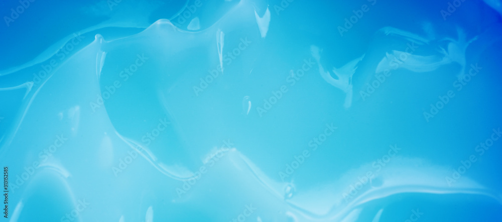 The creamy texture of the blue color. Cosmetic trendy background. macro. The creamy texture of the blue color. Cosmetic trendy background. macro.
