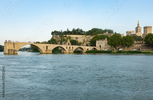 Avignon Bridge with the river in the foreground shot at sunset © pixilatedplanet