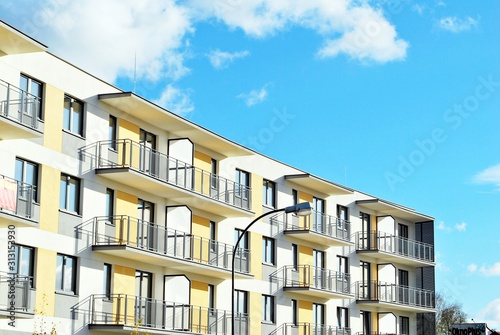 Modern apartment buildings on a sunny day with a blue sky. Facade of a modern apartment building.