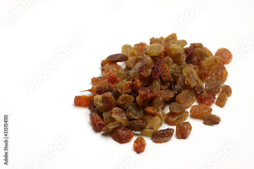 a pile of raisins isolated on white background flat lay. Horizontal image.