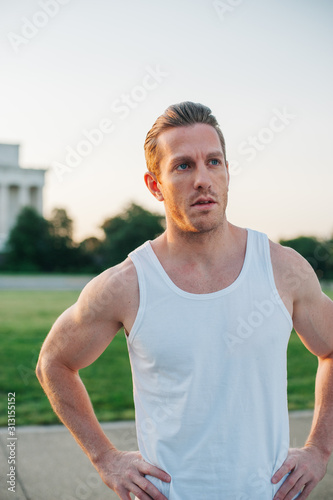 Handsome Caucasian man portrait while resting during a workout outdoors at the National Mall in Washington DC