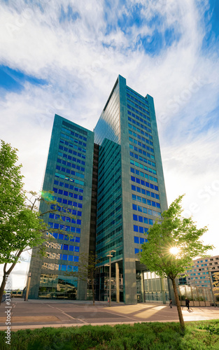 Glass Business office building architecture of Modern City in Vienna in Austria. Urban corporate skyscraper exterior and skyline. Blue windows design of Finance commercial center. Background view.