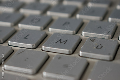 closeup of computer keyboard letter m