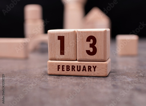 February 13 written with wooden blocks