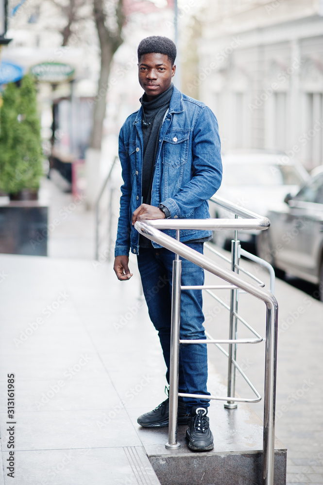 African man wear on jeans jacket posed outdoor. African man wear on jeans jacket posed outdoor.