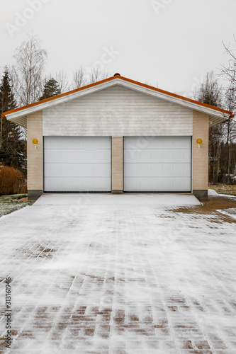garage in winter. car garage in the house in winter in the snow.