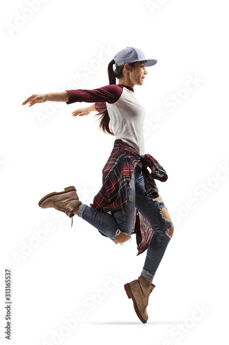 Fototapeta Naklejka Na Ścianę i Meble -  Young female in casual clothes dancing and jumping