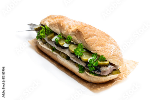 Traditional Dutch sandwich with herring and pickles isolated on white © lena_zajchikova