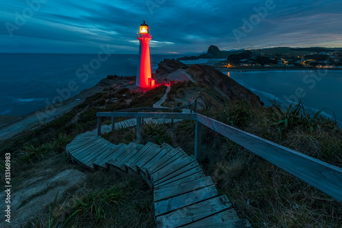 Illuminated lighthouse at dusk, Castlepoint, New Zealand