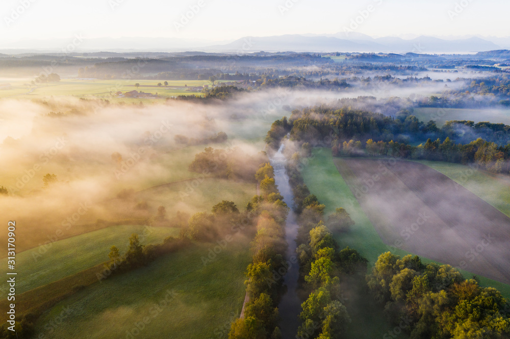 Aerial view of Loisach river canal at foggy dawn Aerial view of Loisach river canal at foggy dawn
