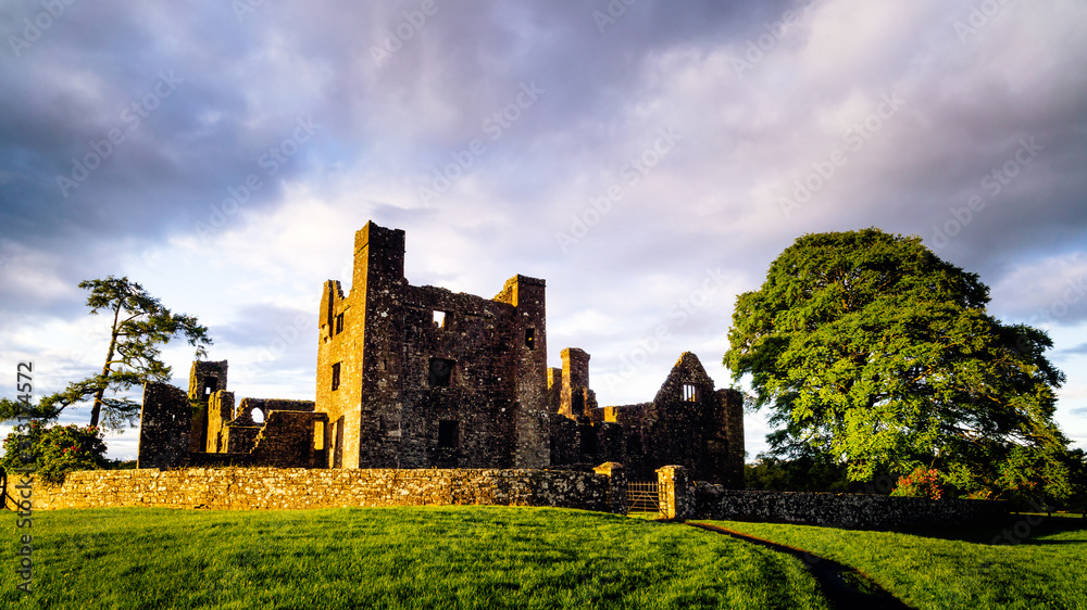 Ruins of Bective Abbey with dramatic sky at sunset. Ireland