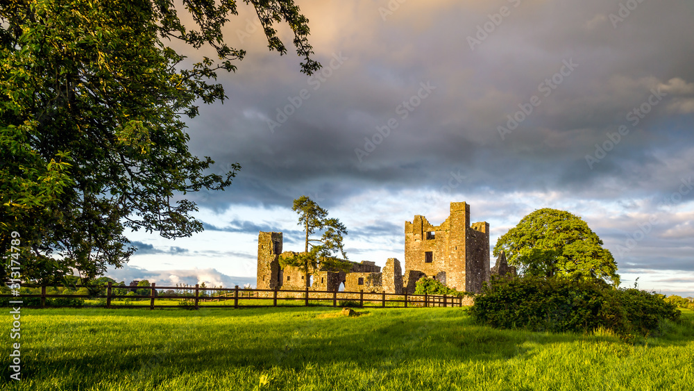 Ruins of Bective Abbey with dramatic sky at sunset. Ireland