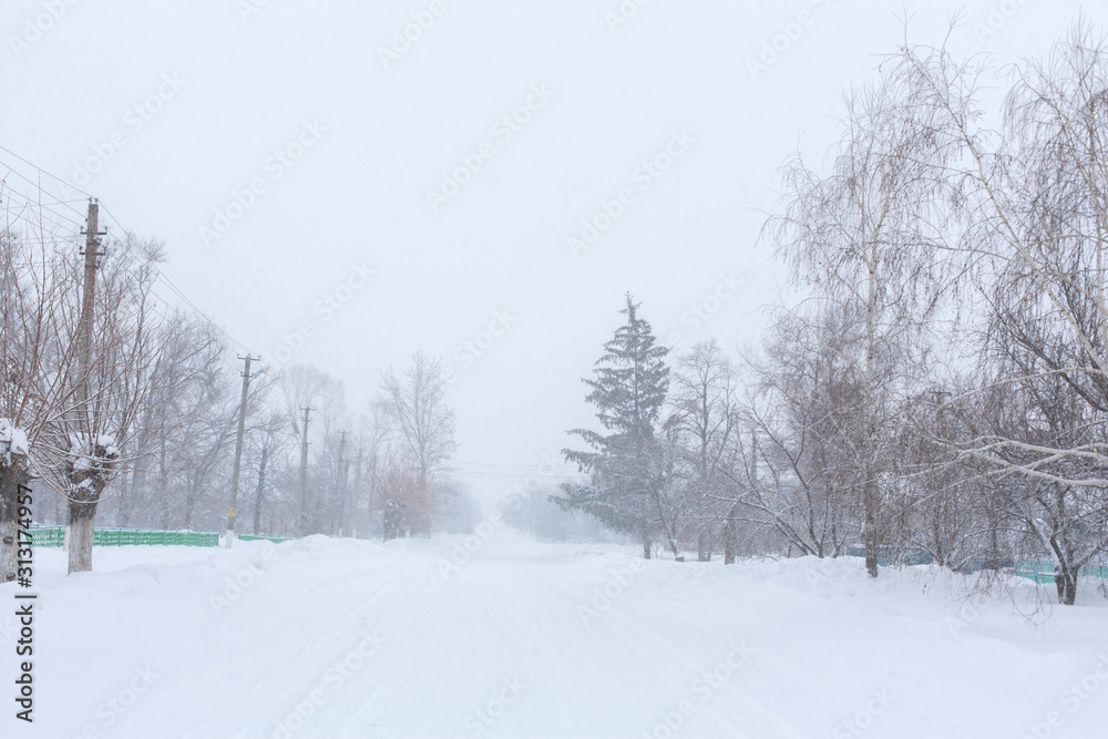 Winter, rural streets are covered with snow. Snow blizzard Winter, rural streets are covered with snow. Snow blizzard