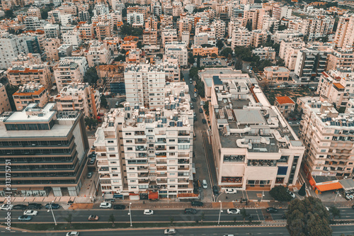 Aerial view of new modern buildings in Limassol city, Cyprus. Cityscape from above, toned
