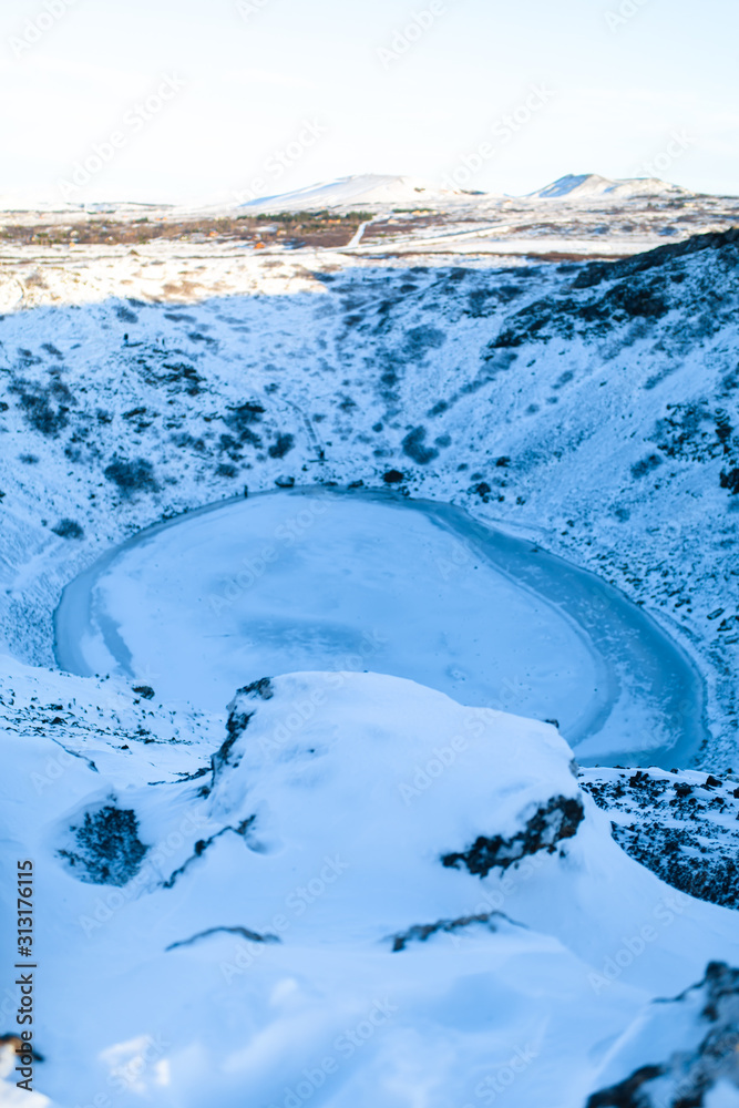 Kerid lake frozen in winter in the crater of an extinct volcano. Incredible iceland landscape in winter Kerid lake frozen in winter in the crater of an extinct volcano. Incredible iceland landscape in winter
