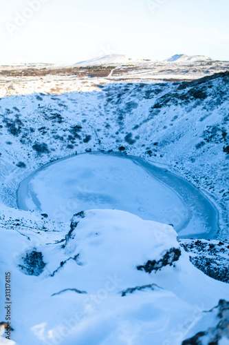 Kerid lake frozen in winter in the crater of an extinct volcano. Incredible iceland landscape in winter