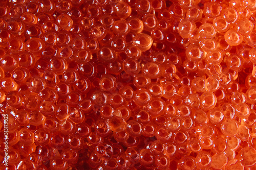 Red caviar. Abstract textured background for wallpaper.