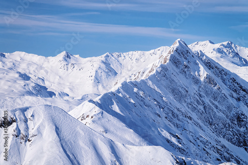 Nature in Hintertux Glacier ski resort in Tyrol in Mayrhofen in Zillertal valley of Austria in winter Alps. Peaks of Hintertuxer Gletscher in Alpine mountains with white snow and blue sky.