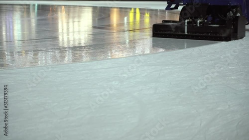 Wallpaper Mural The ice rink cleaner updates the surface of the ice rink in the evening. Close-up. Winter activities and hobbies Torontodigital.ca