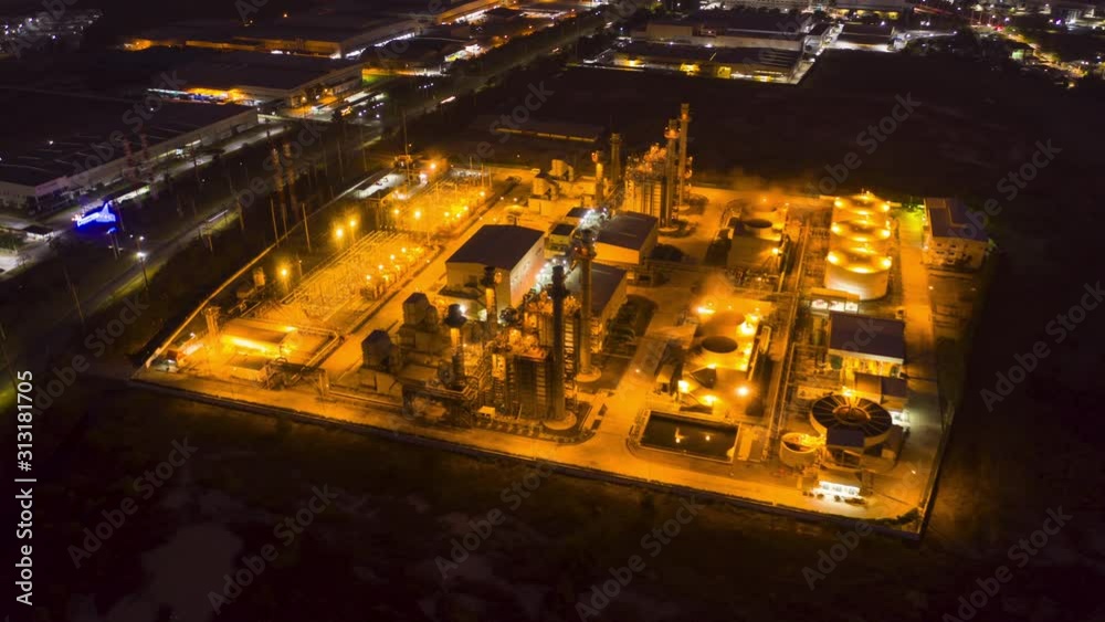 Hyperlapse Timelapse Aerial view night light oil refinery terminal is industrial facility for storage of oil and petrochemical. oil manufacturing products. power electric plant. footage video 4k. Hyperlapse Timelapse Aerial view night light oil refinery terminal is industrial facility for storage of oil and petrochemical. oil manufacturing products. power electric plant. footage video 4k.