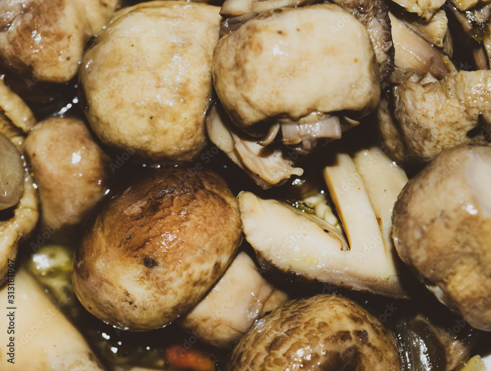 Boiled champignon mushrooms in white plate Boiled champignon mushrooms in white plate