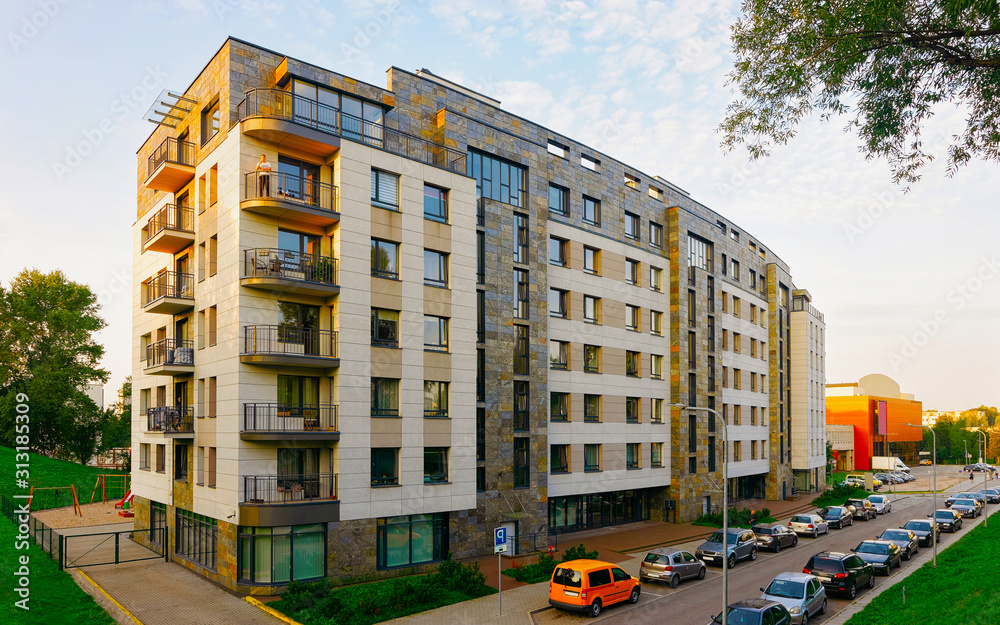 Apartment in residential building exterior. Housing structure at blue modern house of Europe. Rental home in city district on summer. Architecture for business property investment, Vilnius, Lithuania. - obrazy, fototapety, plakaty 