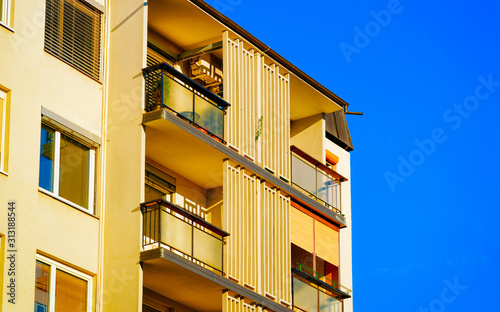 Apartment in residential building exterior. Housing structure at blue modern house of Europe. Rental home in city district on summer. Architecture for business property investment, Maribor Slovenia. © Roman Babakin