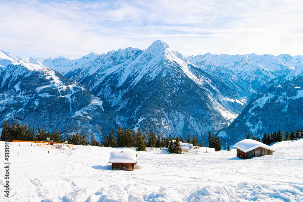 Panorama of ski resort town Mayrhofen with chalet houses in Tyrol in Zillertal valley in Austria, winter Alps. Landscape and cityscape with Alpine mountains with white snow. View from Penken park