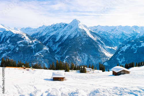 Panorama of ski resort town Mayrhofen with chalet houses in Tyrol in Zillertal valley in Austria, winter Alps. Landscape and cityscape with Alpine mountains with white snow. View from Penken park