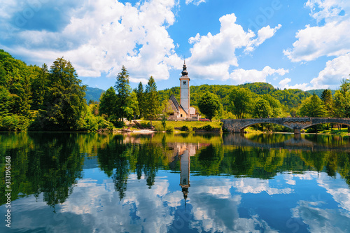 Bild auf Leinwand Scenery and Church of St John Baptist on Bohinj Lake at Slovenia