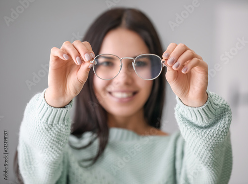 Young woman with stylish ey...