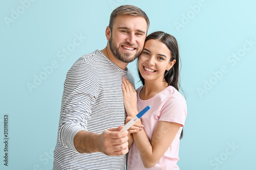 Happy young couple with pre...
