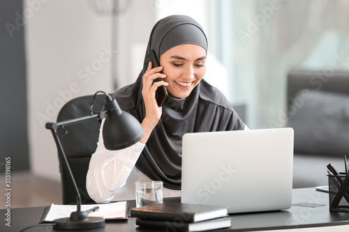 Photography Beautiful Arab businesswoman working in office