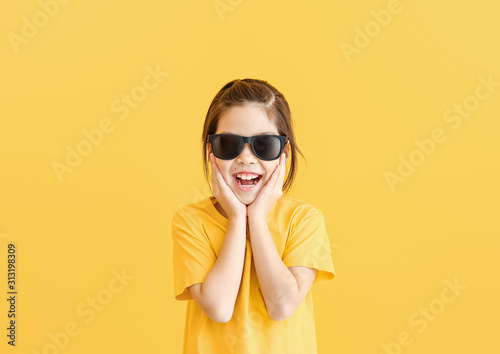 Funny little girl with sung...