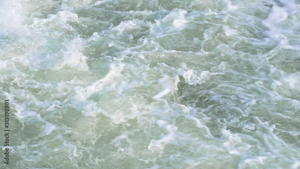 Close up abstract background of crashing flowing water in slowmo Close up abstract background of crashing flowing water in slowmo
