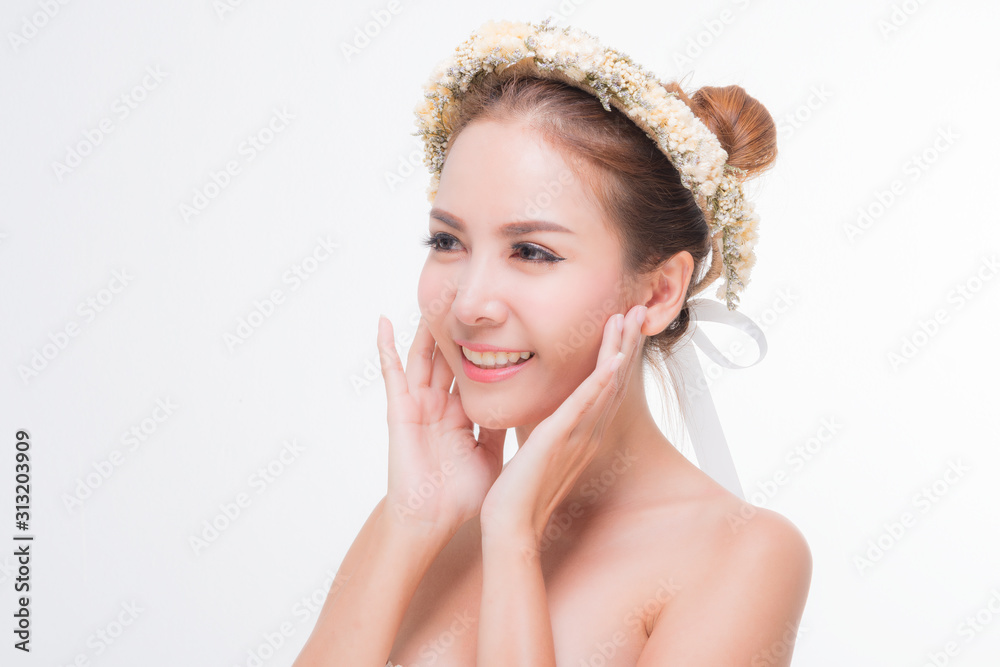 Beautiful young woman with clean fresh skin, Hair sleek, Proposing a product. Gestures for advertisement on pink background, Front view, with copy space.