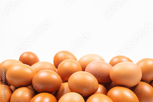Group of brown eggs isolated on white.