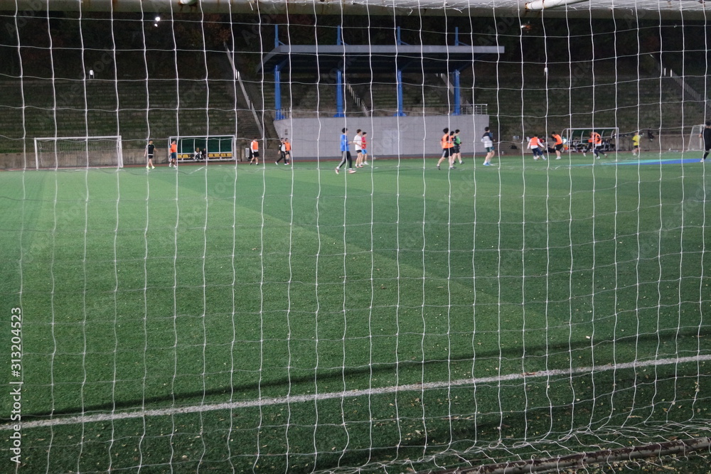 Fototapeta premium Closeup view of goal net in a soccer playground