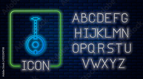 Glowing neon Banjo icon isolated on brick wall background. Musical instrument. Neon light alphabet. Vector Illustration