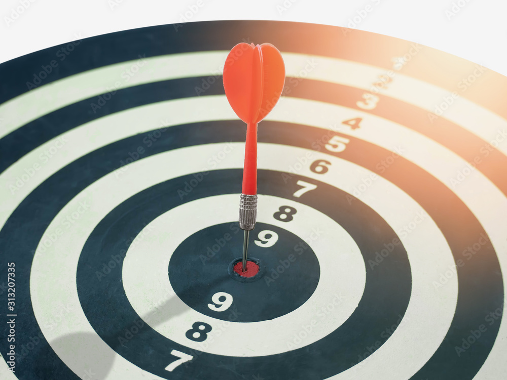Red dart target arrow hitting on bullseye which is the ultimate goal that everyone wants, Target marketing and business success concept Red dart target arrow hitting on bullseye which is the ultimate goal that everyone wants, Target marketing and business success concept