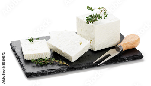 Sliced Feta cheese with herbs .isolated on white background 